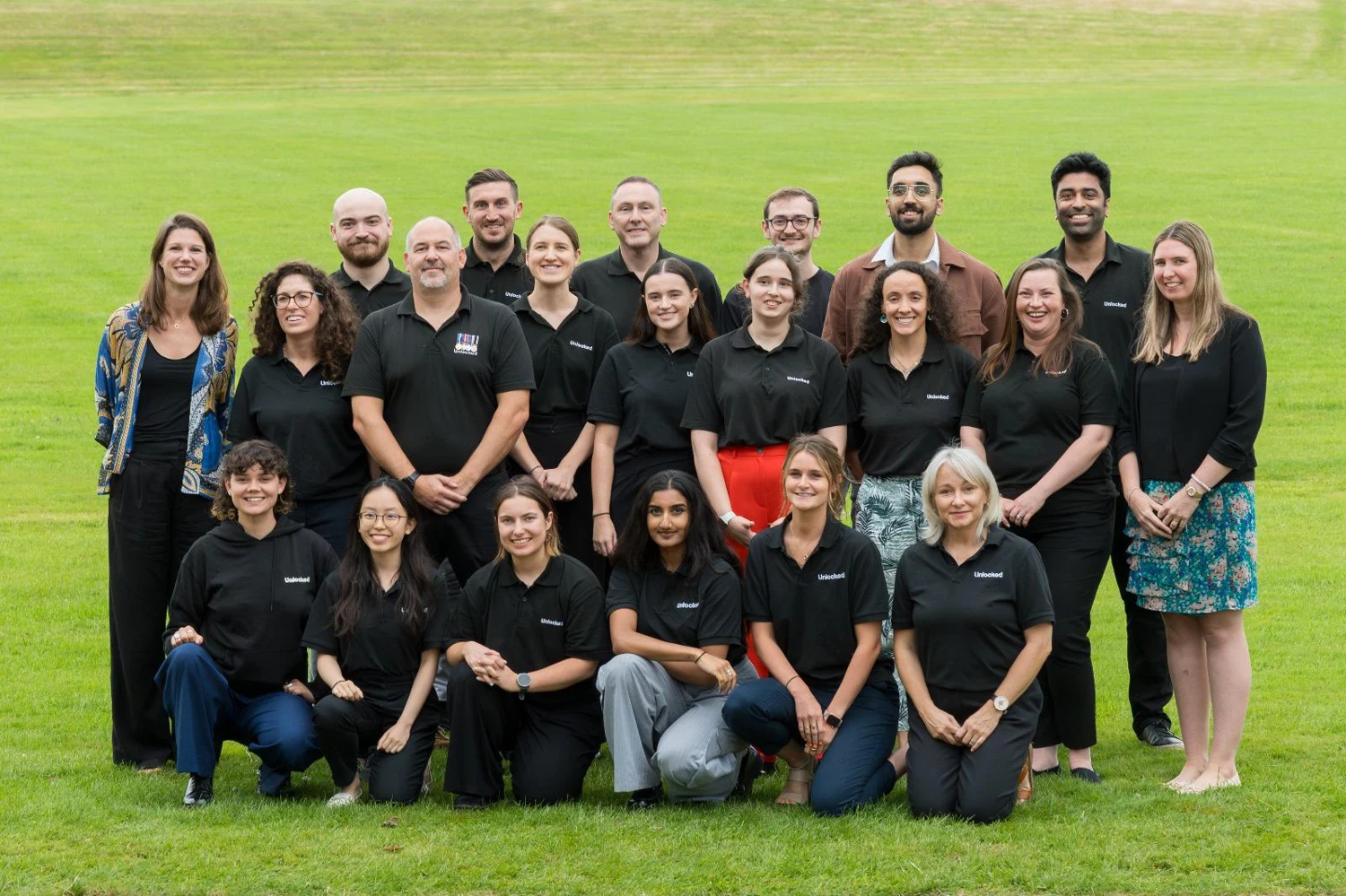 Keshav with the Unlocked Graduates team outdoors
