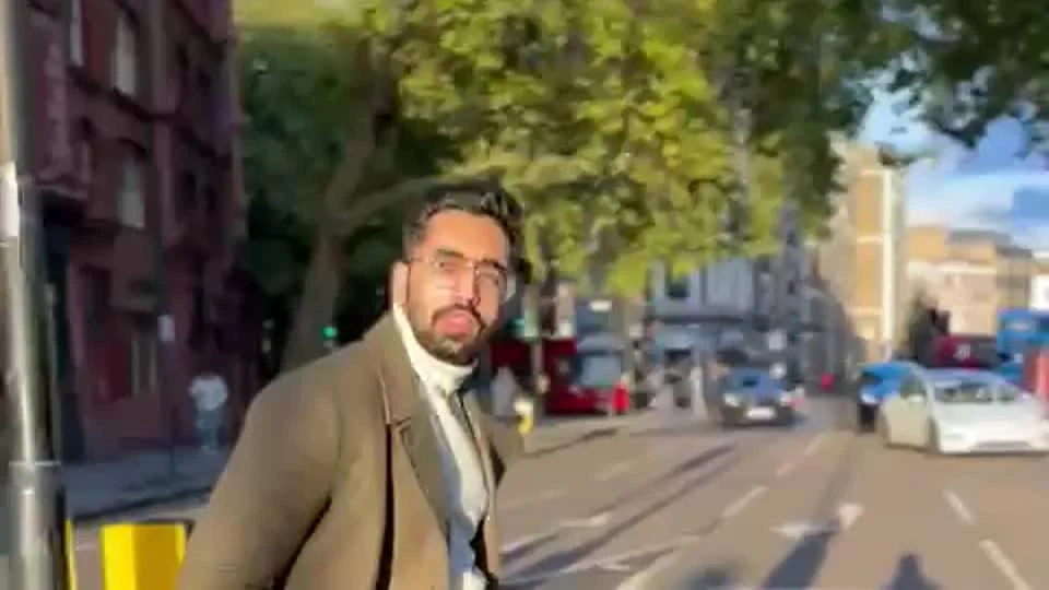 Keshav walking through a tree-lined street